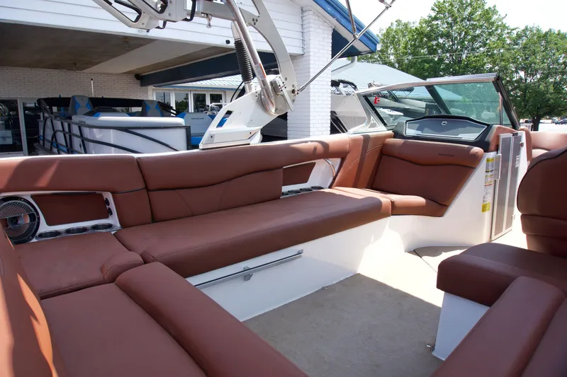 Slide: The Image of 2018 MasterCraft X46 boat interior with brown leather seating and modern design. - 12