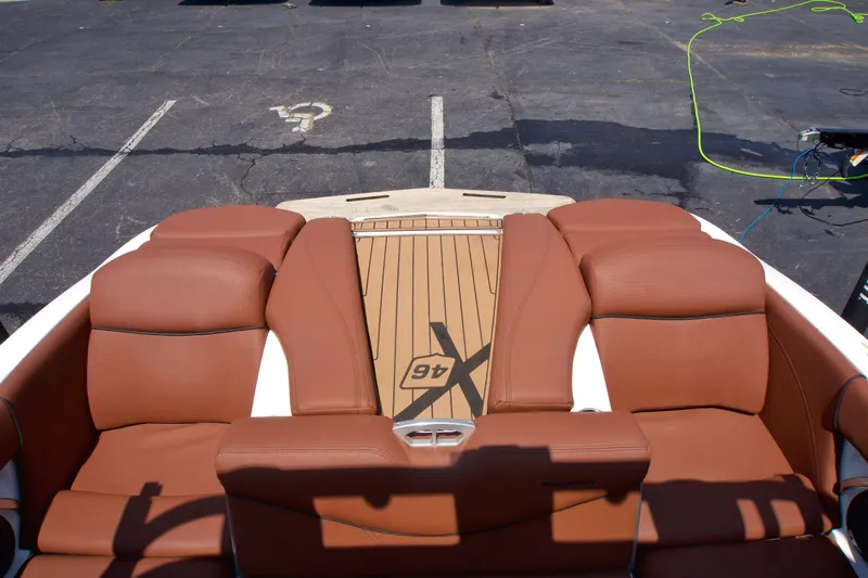 Slide: The Image of 2018 MasterCraft X46 boat with brown leather seating and teak deck. - 14