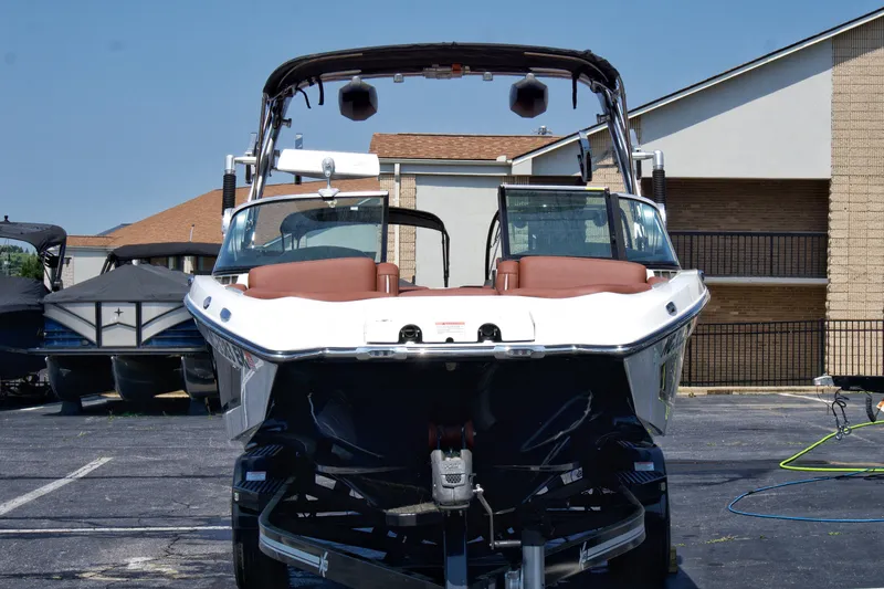 Slide: The Image of 2018 MasterCraft X46 boat parked in a lot, showcasing its sleek design. - 4