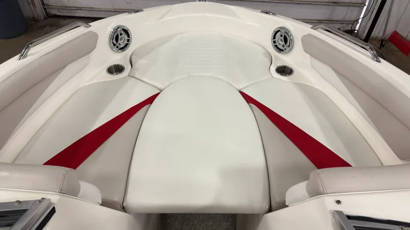 Slide: The Image of Interior of a 2008 Glastron GT 225 boat with white seating. - 14