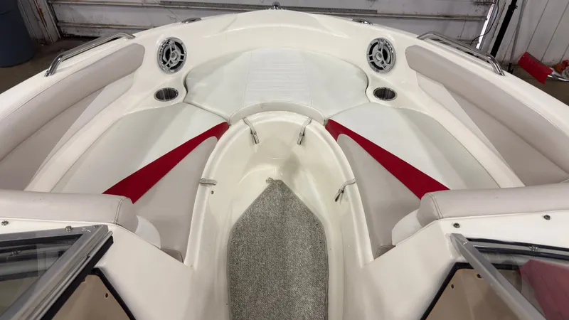 Slide: The Image of Interior of a 2008 Glastron GT 225 boat with red accents. - 15
