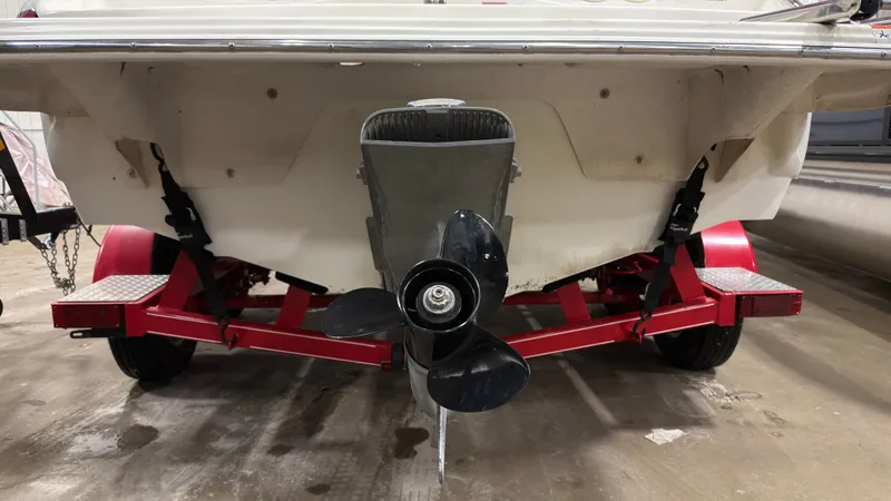 Slide: The Image of Rear view of a 2008 Glastron GT 225 boat on red trailer. - 3