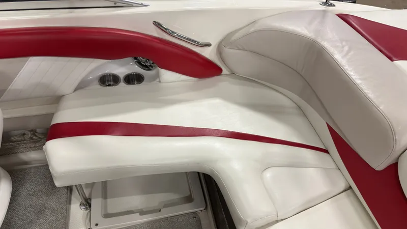 Slide: The Image of Interior of a 2008 Glastron GT 225 with red and white seating. - 8