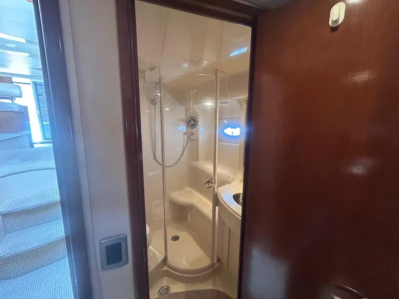 Slide: The Image of 2005 Meridian Gone Dingy 411 Sedan yacht bathroom with shower and sink. - 13