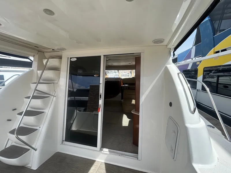 Slide: The Image of 2005 Meridian Gone Dingy 411 Sedan yacht interior with stairs and sliding door. - 4