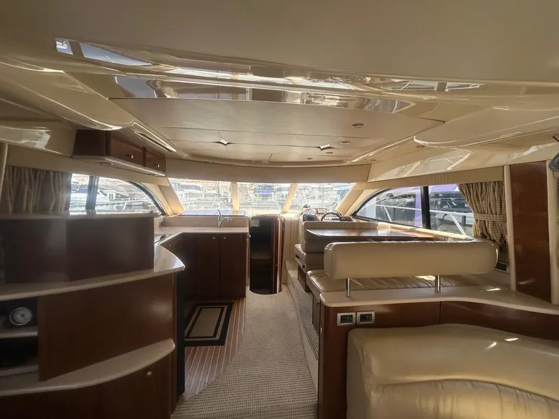 Slide: The Image of Luxurious interior of a 2005 Meridian Gone Dingy 411 Sedan yacht with elegant wood finishes. - 6