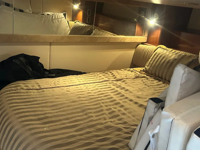 Slide: The Image of Luxurious cabin interior of 2005 Meridian Gone Dingy 411 Sedan with cozy bedding. - 9