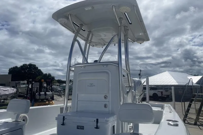 Slide: The Image of 2020 Islamorada Boatworks 24 Morada with T-top and Yeti cooler, parked outdoors. - 12