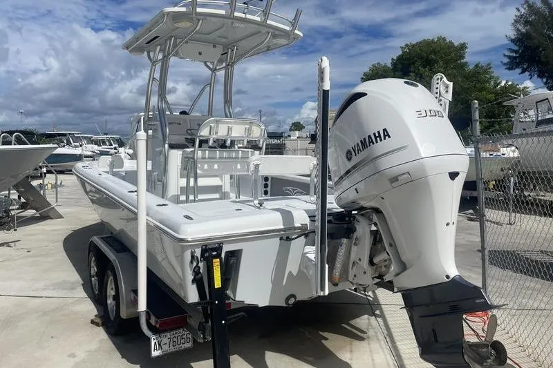 Slide: The Image of 2020 Islamorada Boatworks 24 Morada with Yamaha 300 engine on trailer, parked outdoors. - 17