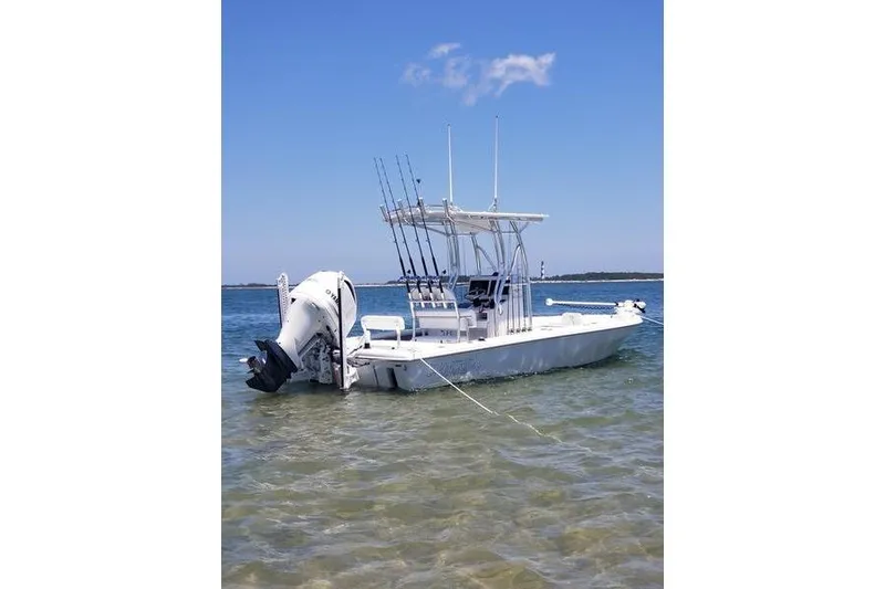 Slide: The Image of 2020 Islamorada Boatworks 24 Morada fishing boat anchored in clear water. - 2