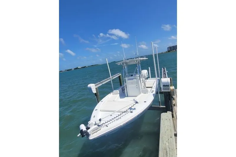 Slide: The Image of 2020 Islamorada Boatworks 24 Morada docked on a sunny day, clear blue water. - 5