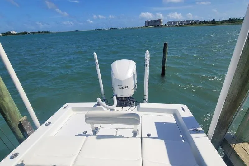 Slide: The Image of 2020 Islamorada Boatworks 24 Morada on water, showcasing outboard motor and scenic view. - 6