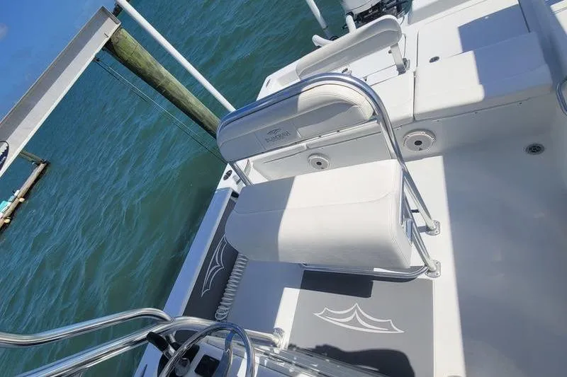 Slide: The Image of 2020 Islamorada Boatworks 24 Morada interior with white seating and ocean view. - 7