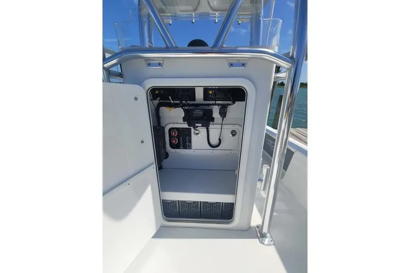 Slide: The Image of 2020 Islamorada Boatworks 24 Morada console with electronic equipment and storage compartment. - 9