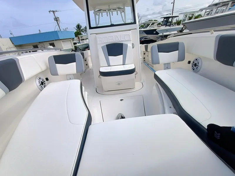 Slide: The Image of 2025 Robalo R270 Center Console boat interior with cushioned seating and modern design. - 33