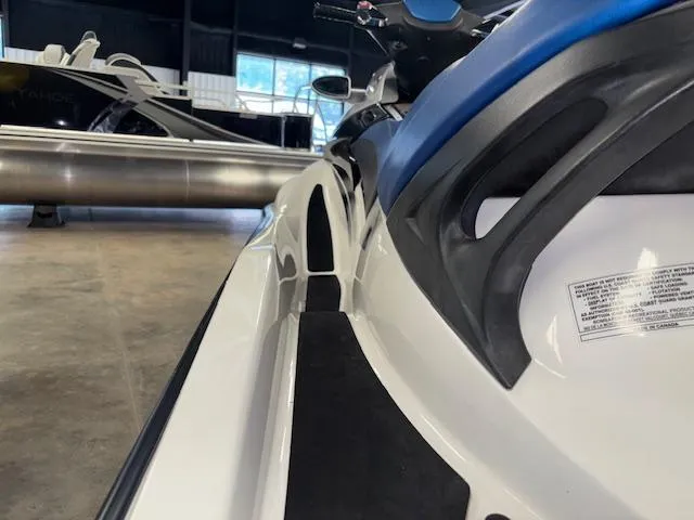 Slide: The Image of 2008 Sea-Doo GTX 155 jet ski with blue seat in showroom. - 13