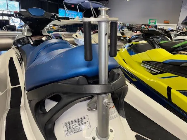 Slide: The Image of 2008 Sea-Doo GTX 155 jet ski with blue seat and handlebar, displayed indoors. - 5