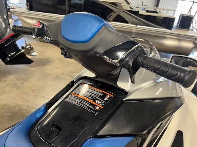 Slide: The Image of 2008 Sea-Doo GTX 155 jet ski handlebars and seat in a showroom. - 9