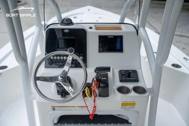 Slide: The Image of 2024 Sea Pro 208 Bay boat console with steering wheel and controls. - 20