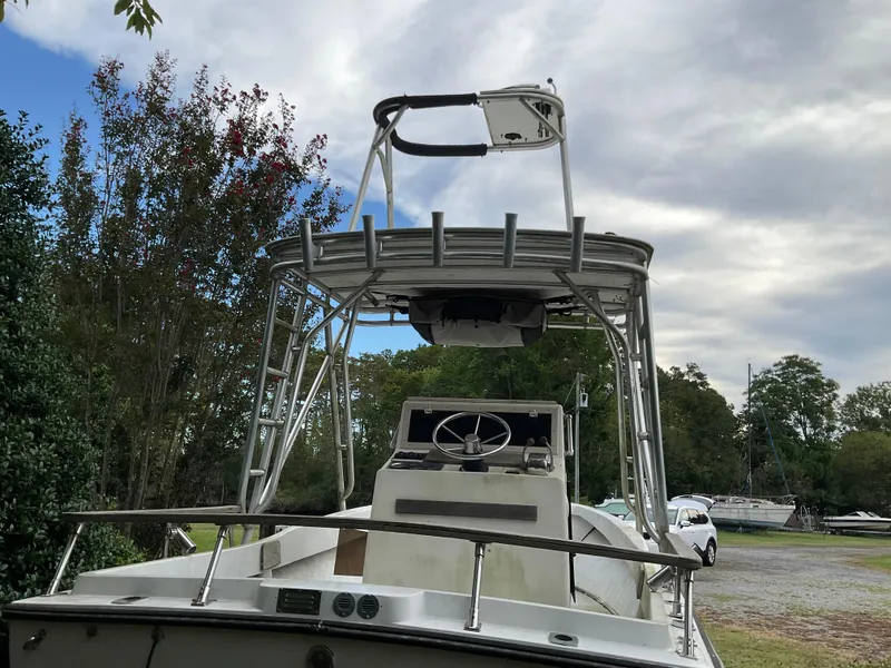 Slide: The Image of 1978 Shamrock 200 cc boat with tower, parked outdoors under cloudy sky. - 3