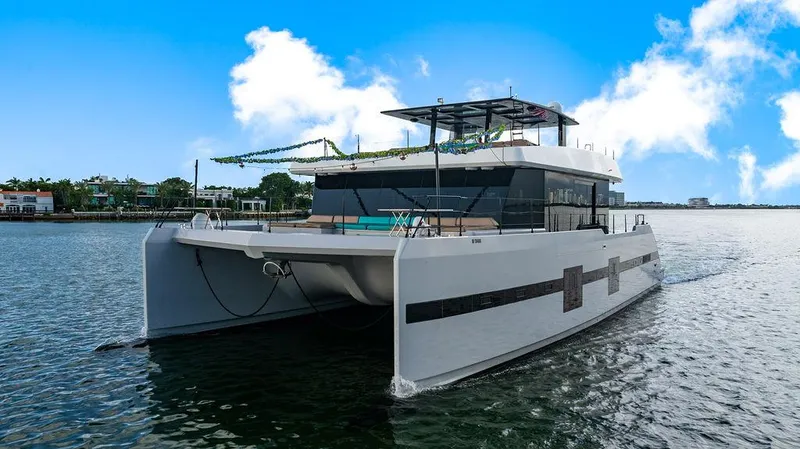 Slide: The Image of Luxury Sunreef 70 catamaran yacht, 2018 model, cruising on a sunny day. - 13