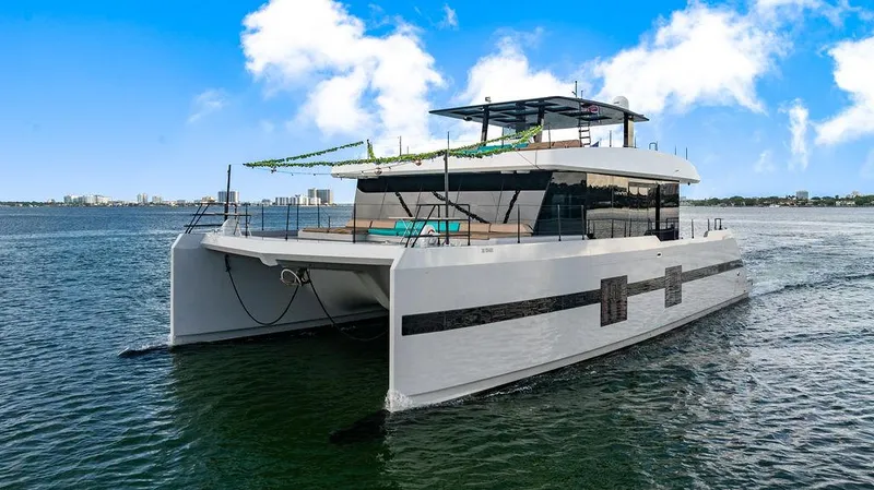 Slide: The Image of Luxurious 2018 Sunreef 70 yacht cruising on a sunny day with clear blue skies. - 19