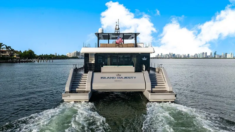 Slide: The Image of Luxury Sunreef 70 yacht cruising with city skyline in background, 2018 model. - 24