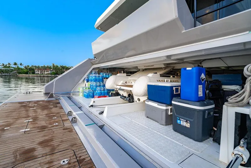 Slide: The Image of Storage area on a 2018 Sunreef 70 yacht with coolers and water bottles. - 34