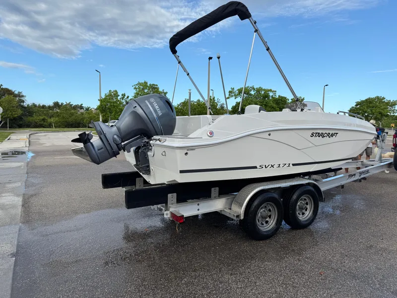 Slide: The Image of 2024 Starcraft SVX 171 OB boat on trailer, featuring Yamaha outboard motor. - 5
