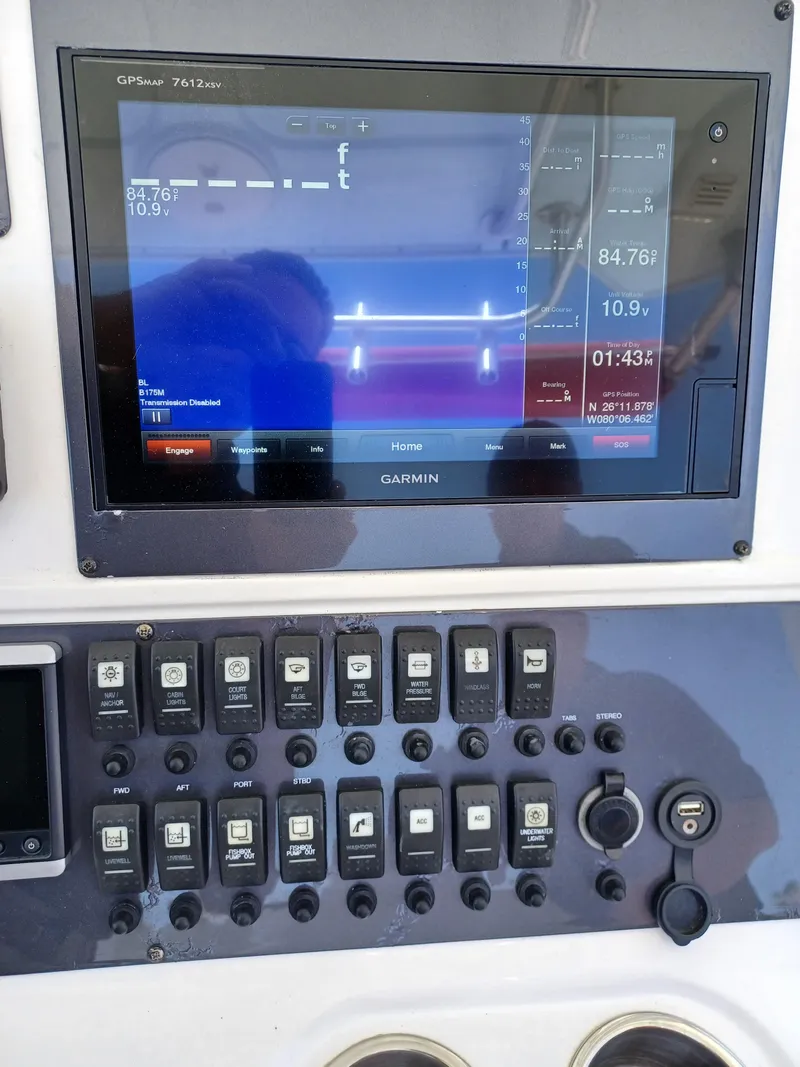 Slide: The Image of Garmin navigation system and control panel on a 2016 Robalo R300 Center Console boat. - 10
