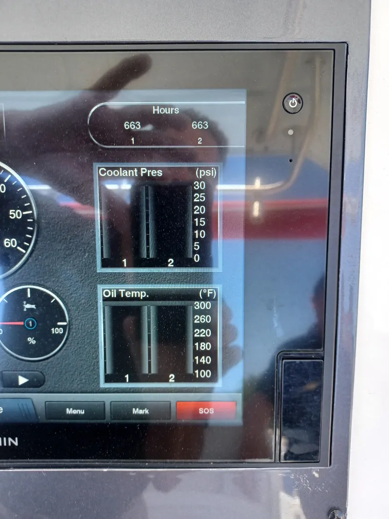 Slide: The Image of Close-up of 2016 Robalo R300 Center Console engine monitor display. - 14