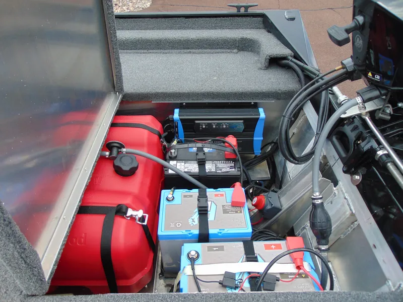 Slide: The Image of 2024 Crestliner 1700 Storm boat battery and fuel compartment with wiring and equipment. - 12