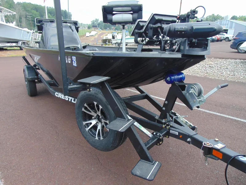 Slide: The Image of 2024 Crestliner 1700 Storm boat on trailer, featuring modern design and equipment. - 3