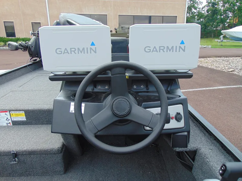 Slide: The Image of 2024 Crestliner 1700 Storm boat dashboard with Garmin navigation systems. - 5