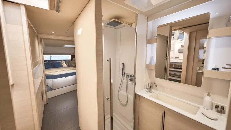 Slide: The Image of People relaxing inside a 2026 Fountaine Pajot 44 yacht, enjoying the ocean view. - 22