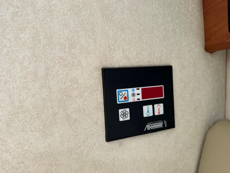 Slide: The Image of Control panel on 2005 Rinker Fiesta Vee 300 boat interior. - 13