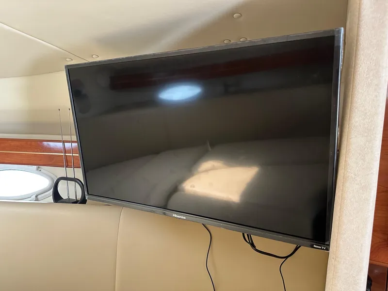 Slide: The Image of Flat-screen TV inside 2005 Rinker Fiesta Vee 300 boat cabin. - 15