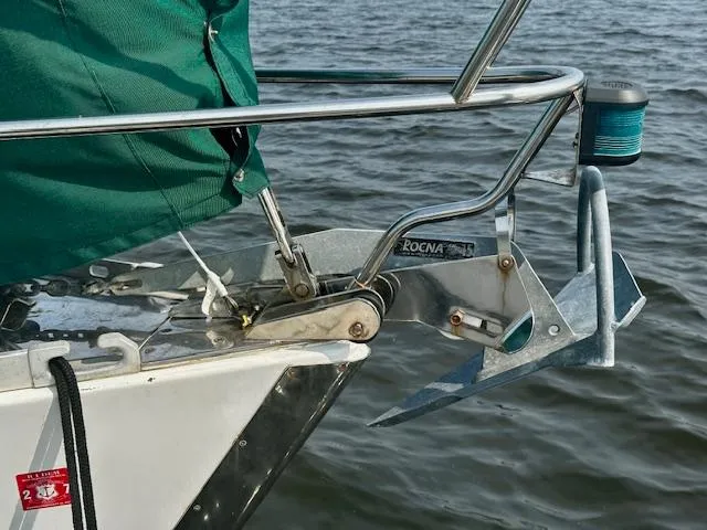 Slide: The Image of Bow of a 1998 Freedom 35 sailboat with Rocna anchor over water. - 12