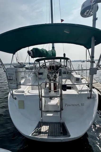 Slide: The Image of Sailboat docked with green canopy, Freedom 35 model, 1998, Pawtuxet, RI. - 17