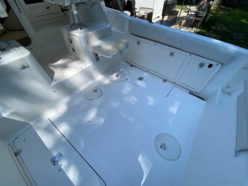 Slide: The Image of 2006 Century 2600 Walkaround boat dashboard with Garmin and Raymarine electronics. - 12