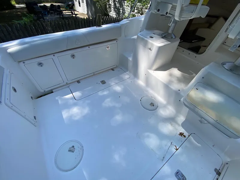 Slide: The Image of 2006 Century 2600 Walkaround boat with overhead storage and metal framework. - 14