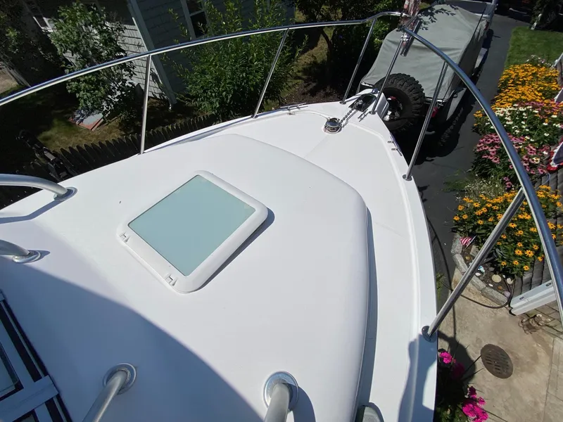 Slide: The Image of Storage compartment on a 2006 Century 2600 Walkaround boat, featuring electrical outlets and cable management. - 20