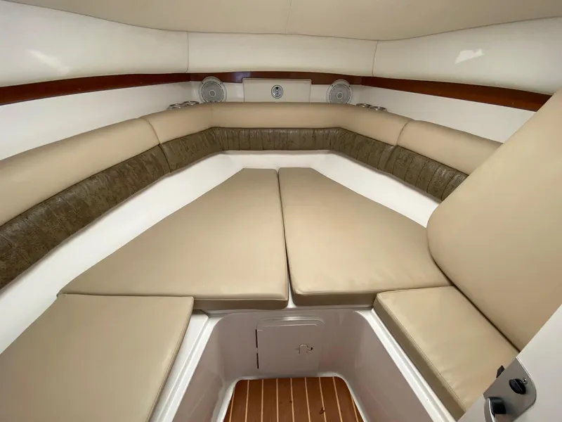 Slide: The Image of Interior cabin of 2006 Century 2600 Walkaround boat with beige seating. - 23