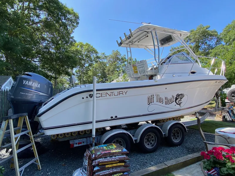 Slide: The Image of 2006 Century 2600 Walkaround boat with twin Yamaha 150 outboard engines. - 3