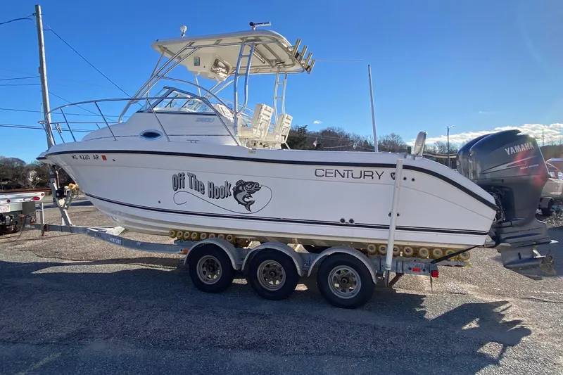 Slide: The Image of 2006 Century 2600 Walkaround boat bathroom interior with compact toilet and sink. - 31
