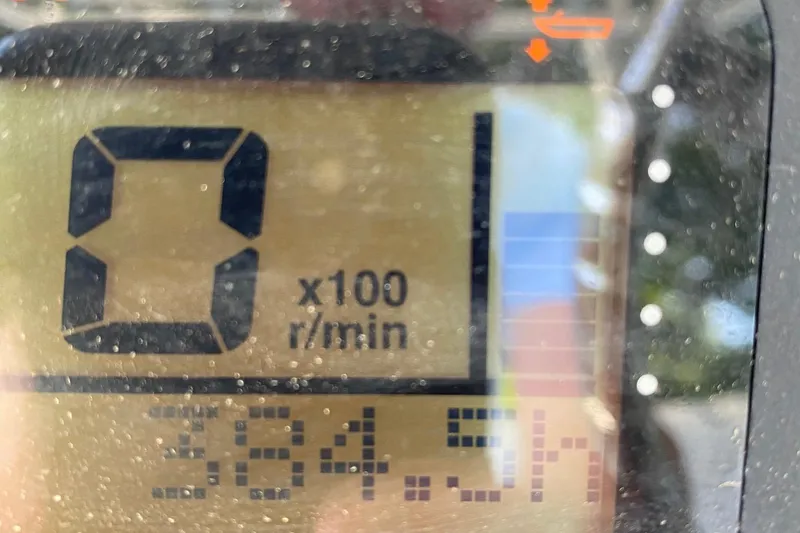 Slide: The Image of 2006 Century 2600 Walkaround boat cockpit with dual seats and steering wheel. - 8