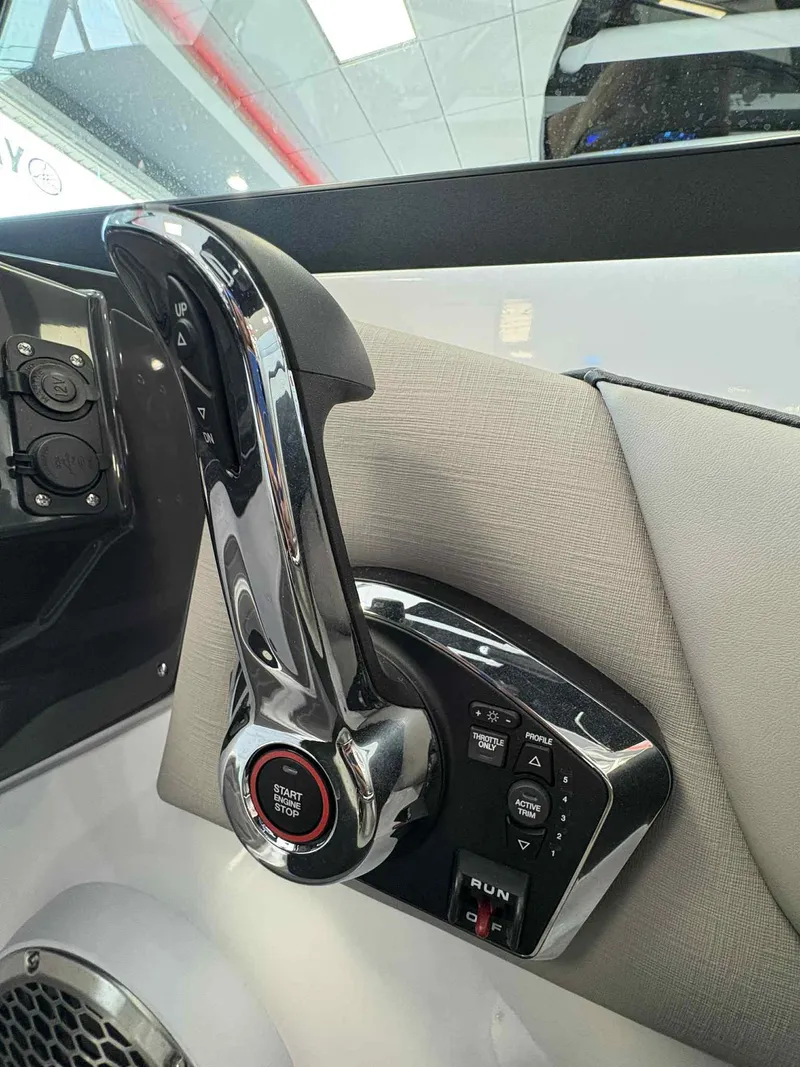 Slide: The Image of Throttle control panel of a 2026 Monterey M65 boat with start/stop button. - 14