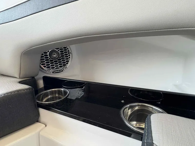 Slide: The Image of Interior of 2026 Monterey M65 boat with speaker and cup holders. - 15