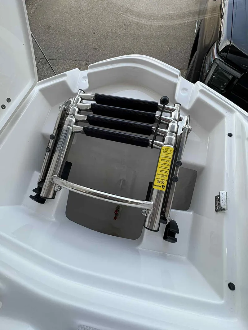 Slide: The Image of Foldable boat ladder on a 2026 Monterey M65, featuring stainless steel construction. - 18