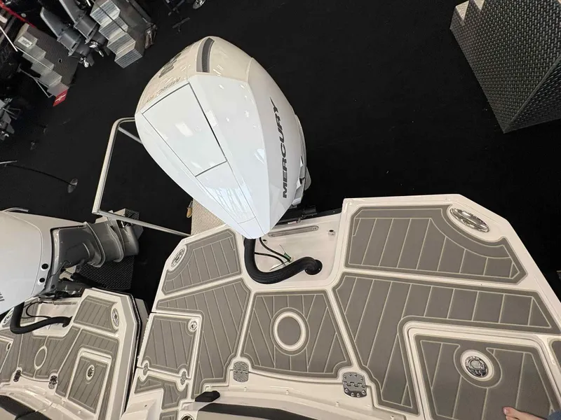 Slide: The Image of 2026 Monterey M65 boat with Mercury outboard engine, featuring sleek deck design. - 20